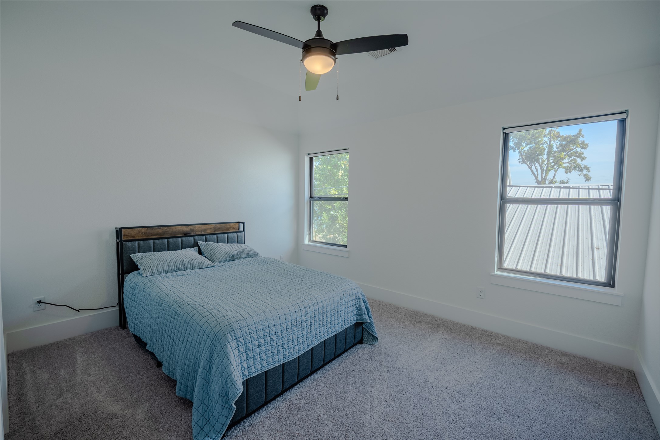 8810 Carousel Lane Houston, TX 77080 - Photo 27 of 37 a bedroom with a bed and a window