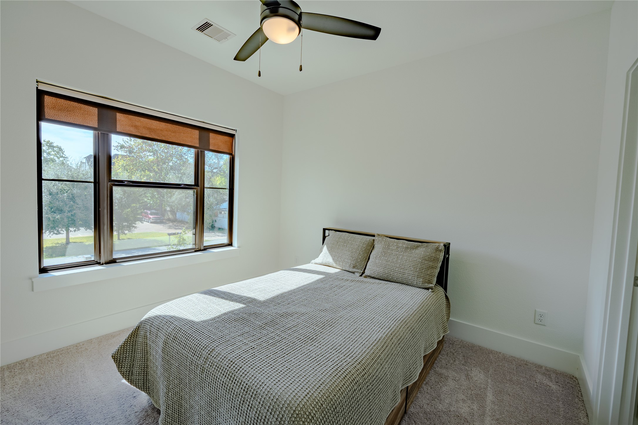 8810 Carousel Lane Houston, TX 77080 - Photo 33 of 37 a bedroom with a bed and window