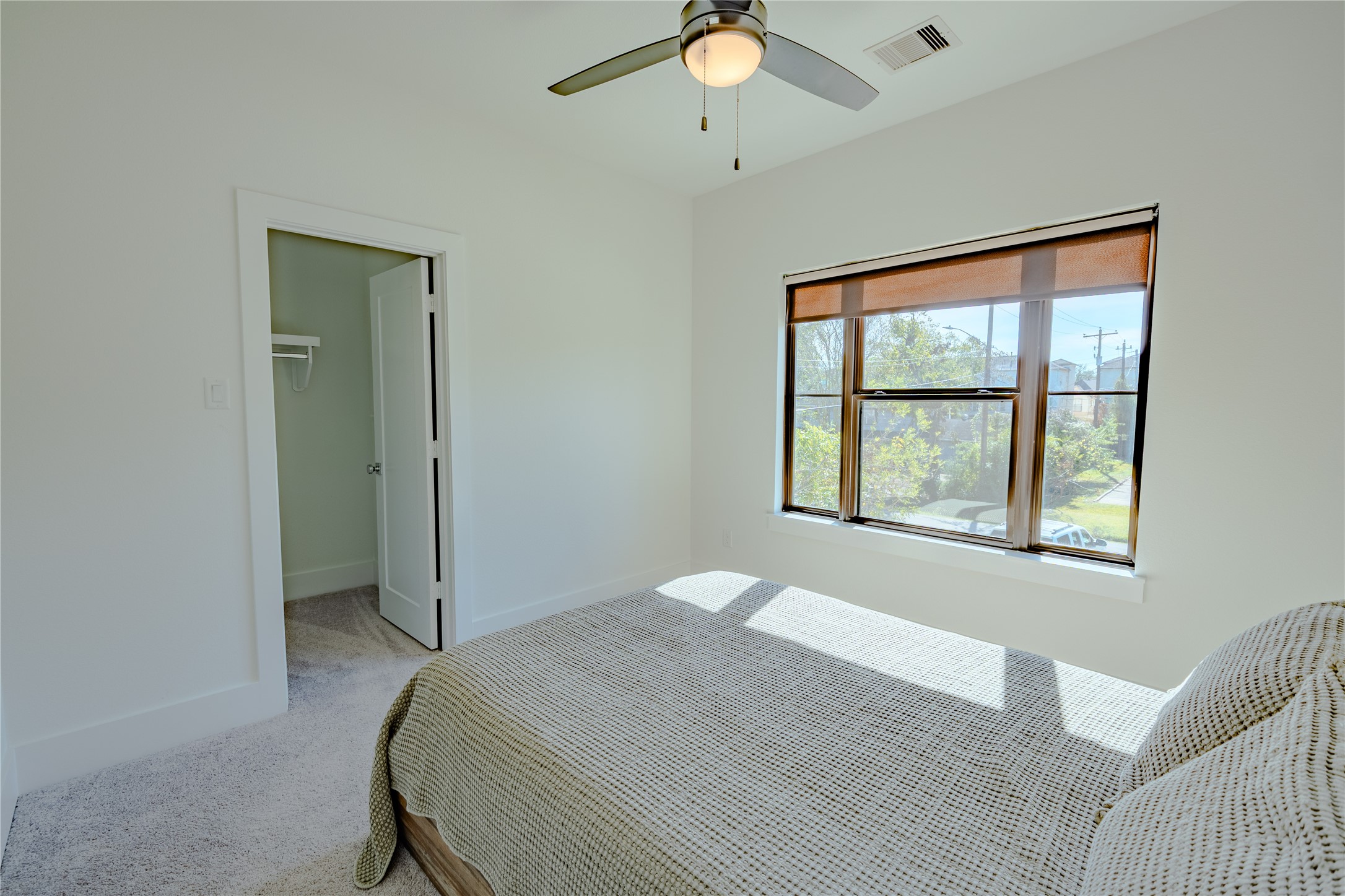 8810 Carousel Lane Houston, TX 77080 - Photo 34 of 37 a bedroom with a bed and a window