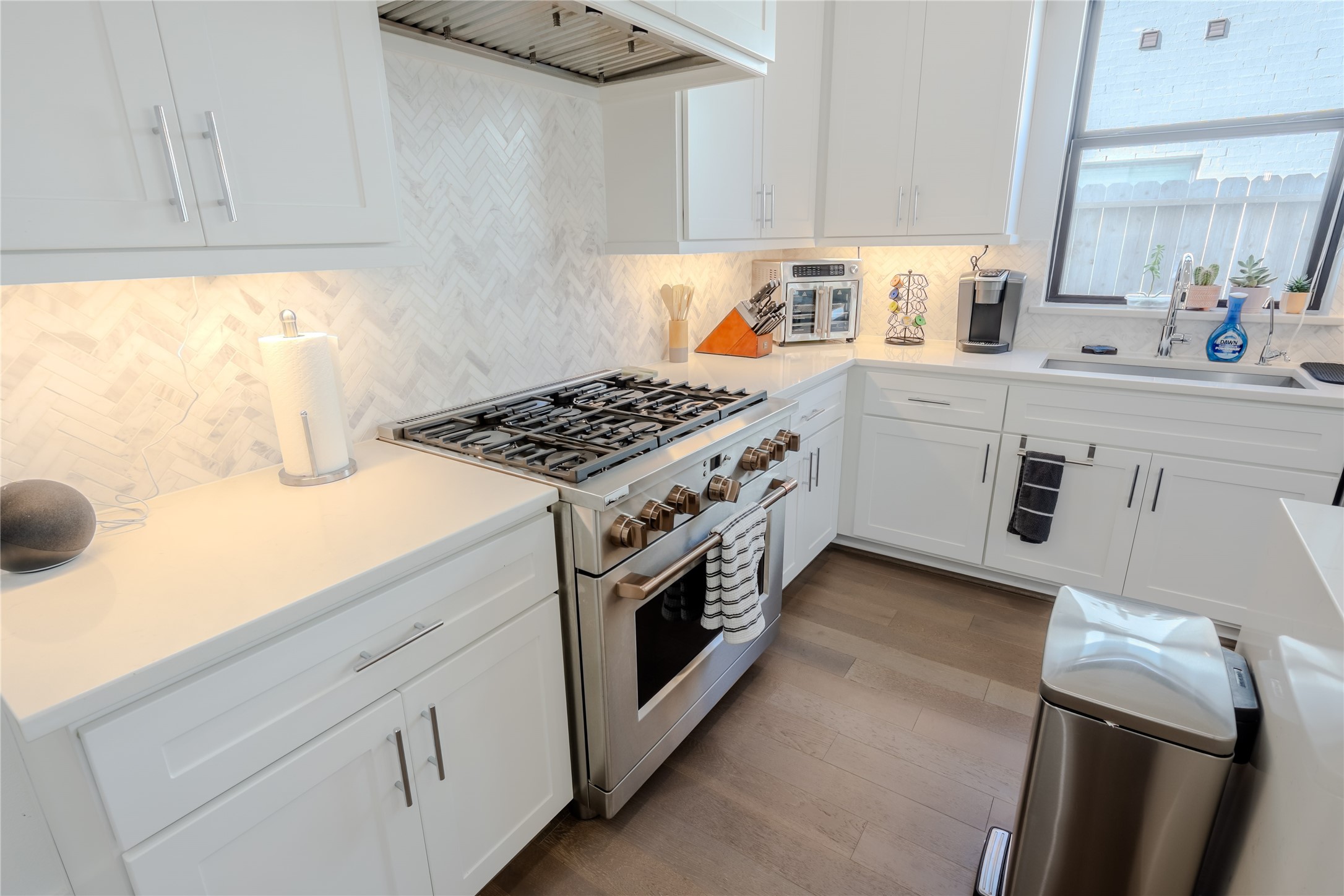 8810 Carousel Lane Houston, TX 77080 - Photo 10 of 37 a kitchen with a stove and a sink