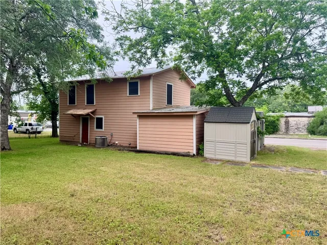 a house view with a garden space