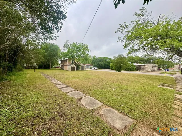 a view of an ocean with a yard