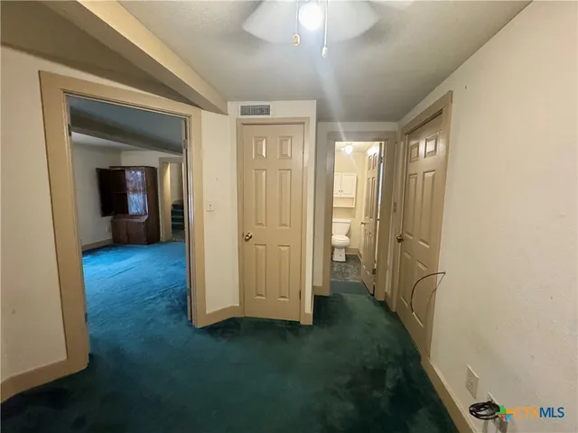 wooden floor in a hall with a window