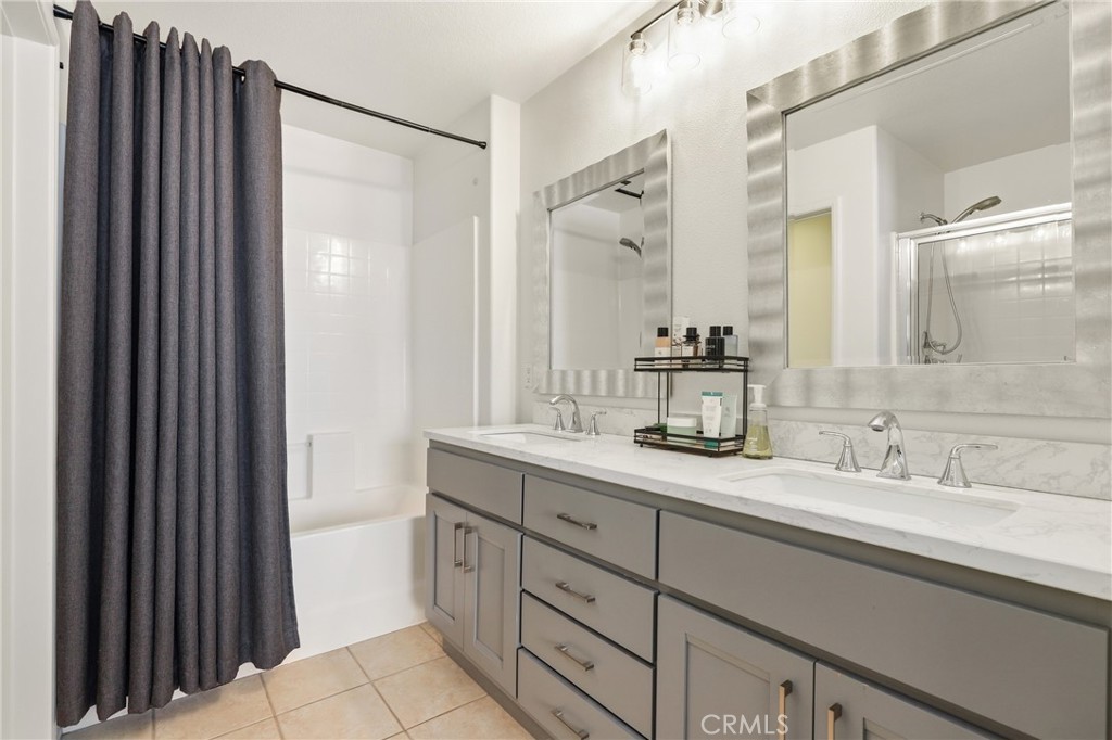 52 Valmont Way Ladera Ranch, CA 92694 - Photo 13 of 29 a bathroom with a double vanity sink mirror and double