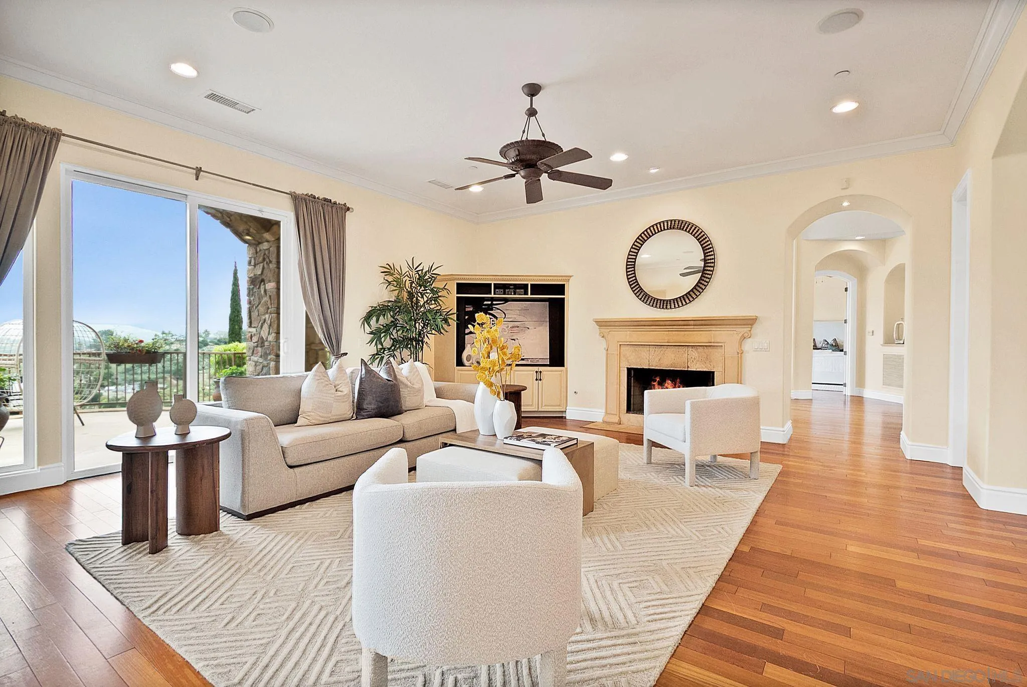 12920 Glen Circle Road Poway, CA 92064 - Photo 25 of 69 a living room with furniture a large window and a fireplace