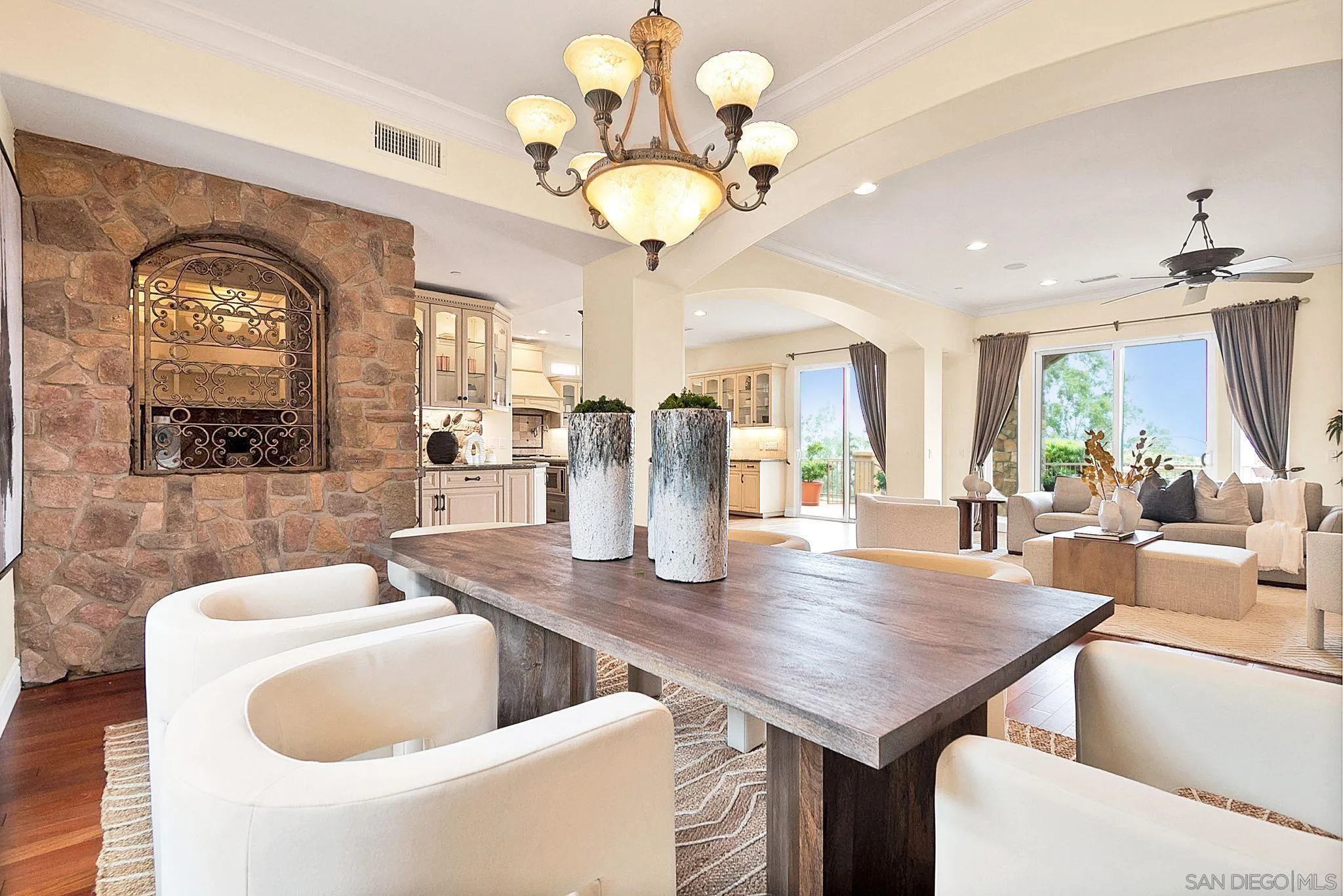 12920 Glen Circle Road Poway, CA 92064 - Photo 27 of 69 a kitchen with a table chairs and a chandelier