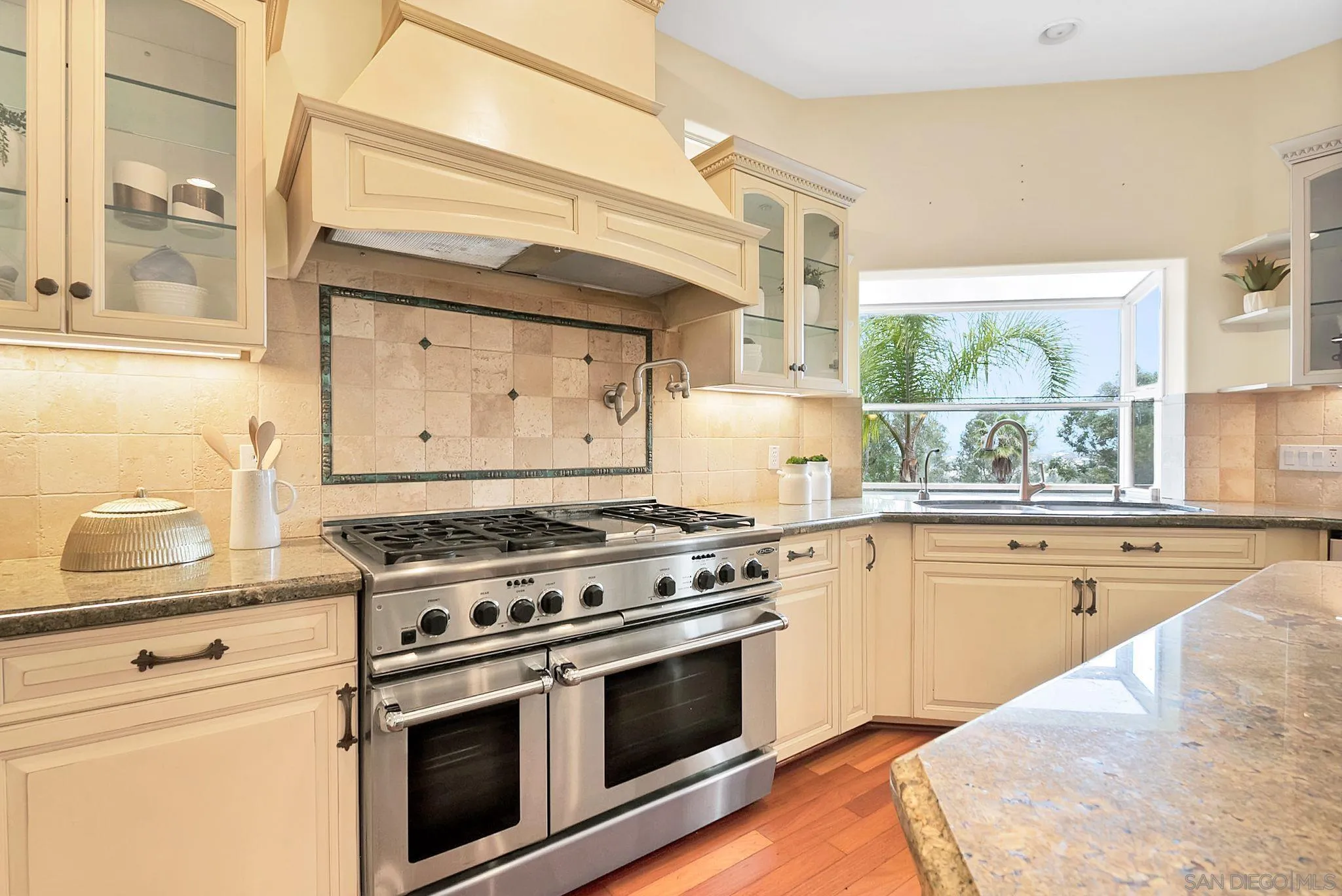 12920 Glen Circle Road Poway, CA 92064 - Photo 32 of 69 a kitchen with a stove and a wooden floor