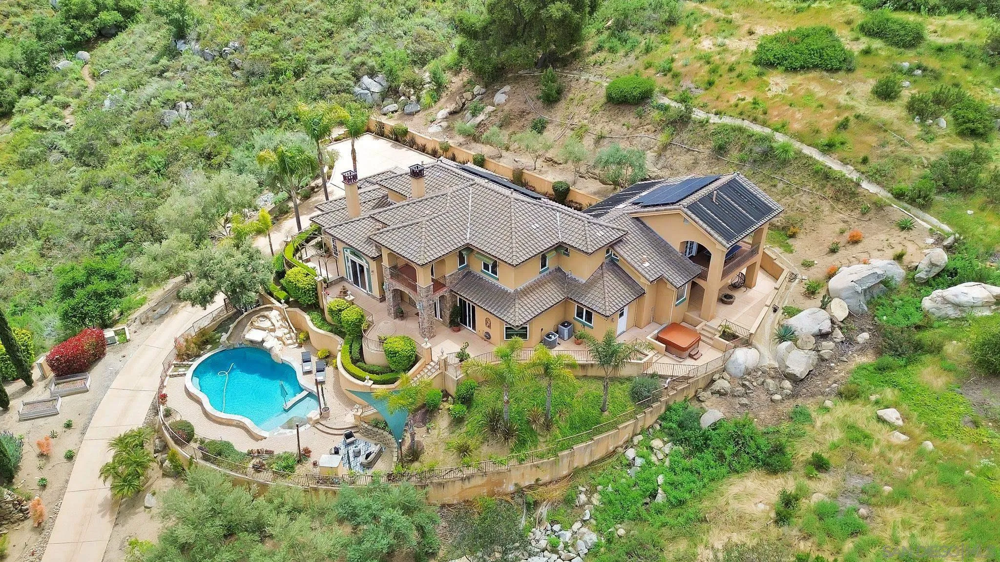 12920 Glen Circle Road Poway, CA 92064 - Photo 5 of 69 an aerial view of a house with a yard and garden
