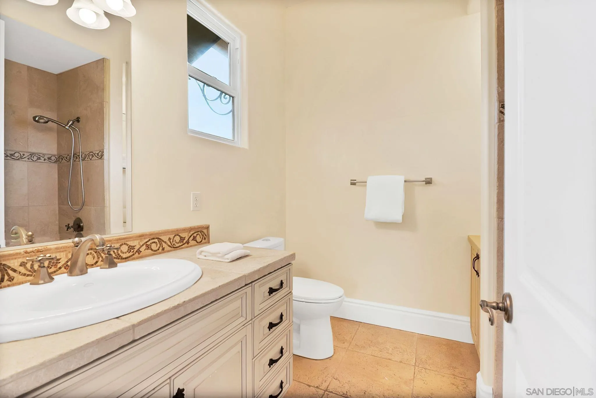 12920 Glen Circle Road Poway, CA 92064 - Photo 53 of 69 a bathroom with a sink a toilet and a mirror