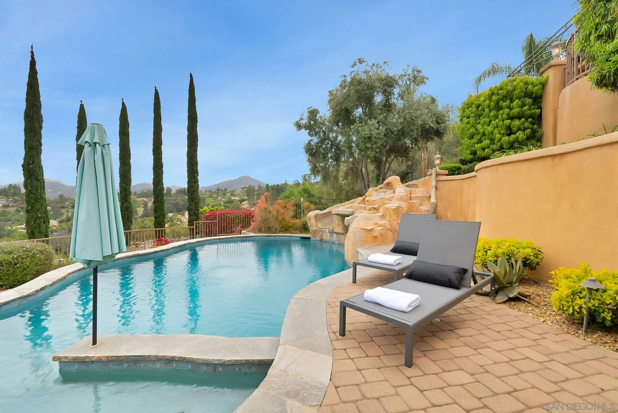 12920 Glen Circle Road Poway, CA 92064 - Photo 59 of 69 a balcony with wooden floor and outdoor seating