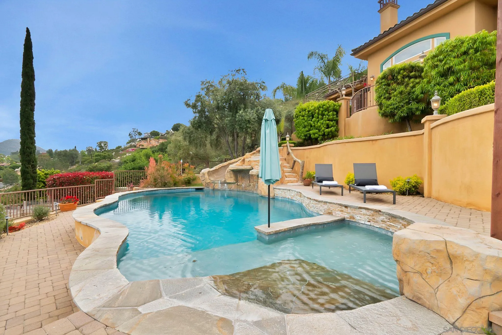 12920 Glen Circle Road Poway, CA 92064 - Photo 60 of 69 a view of a swimming pool with a lounge chairs