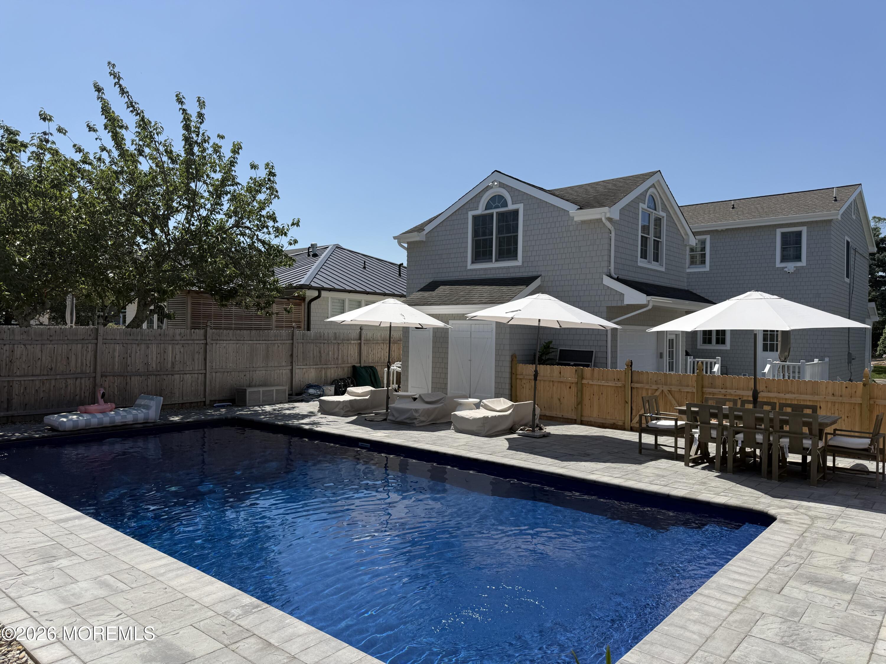 217 Howe Street Point Pleasant, NJ 08742 - Photo 27 of 29 a outdoor space with lots of trees