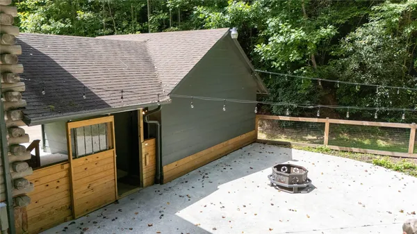 a view of a backyard with wooden floor and sink