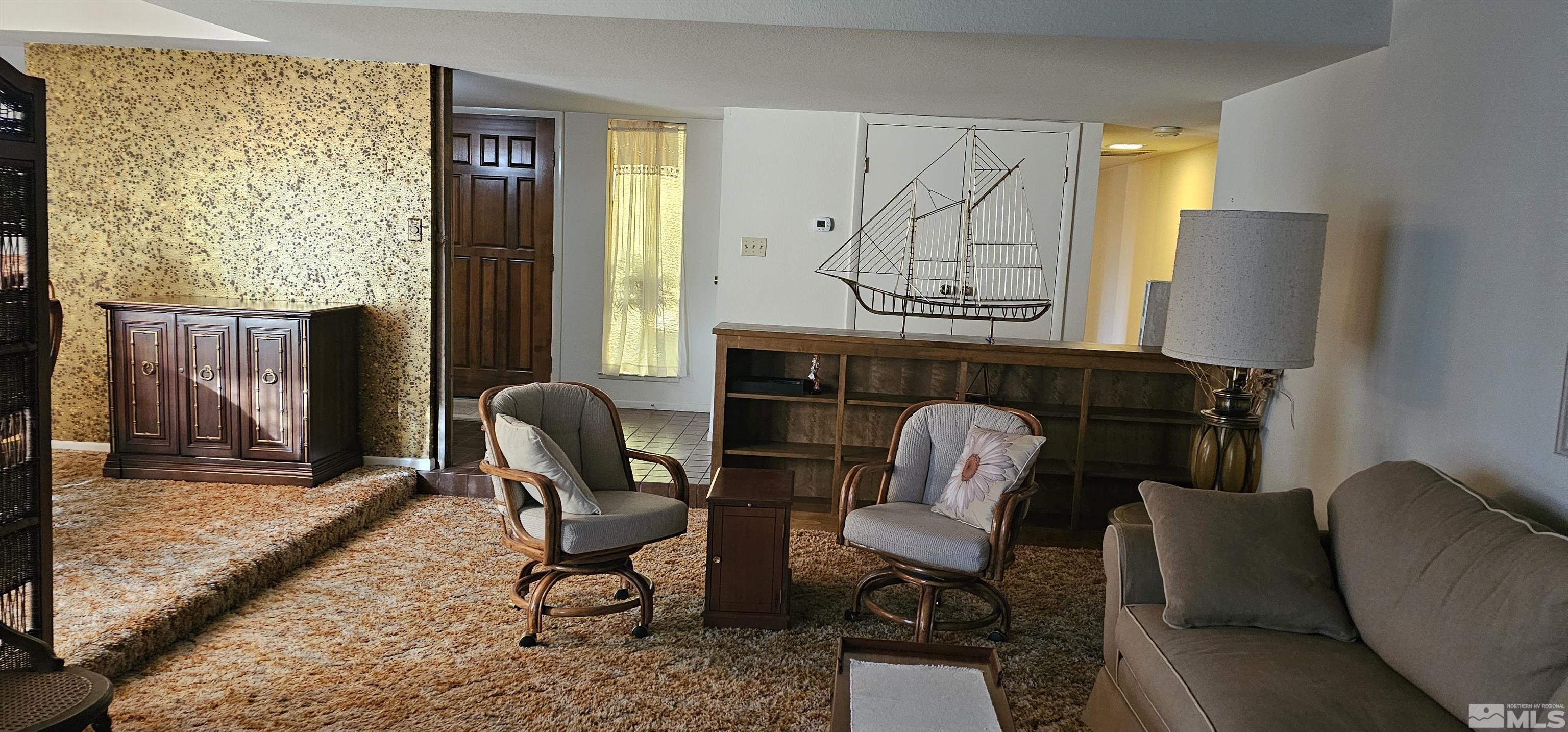 1475 Joshua Drive Reno, NV 89509 - Photo 4 of 27 a living room with furniture and a window