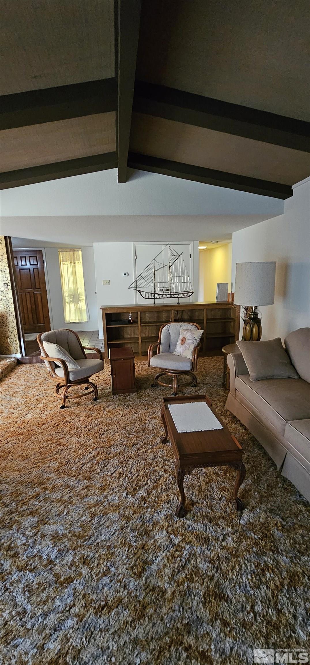 1475 Joshua Drive Reno, NV 89509 - Photo 7 of 27 a living room with furniture and a couch