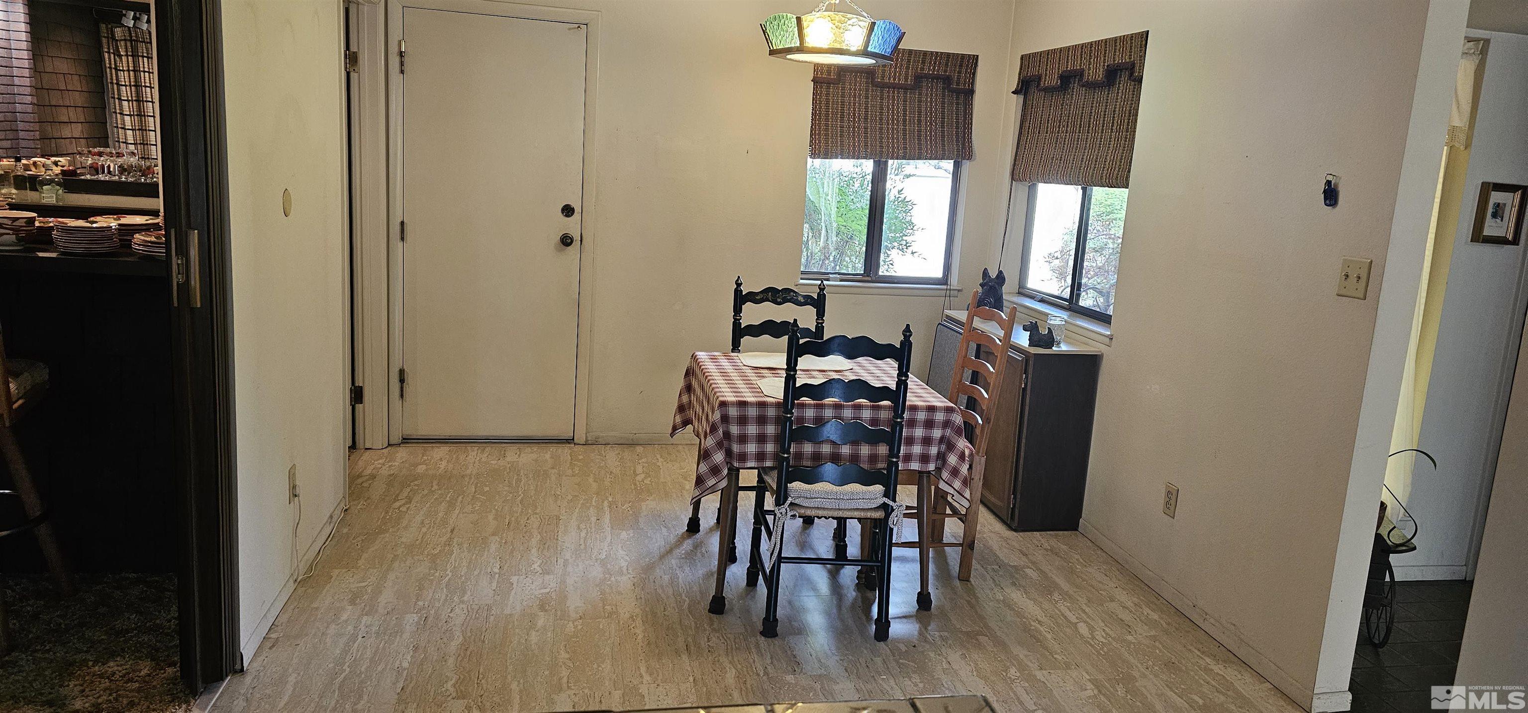 1475 Joshua Drive Reno, NV 89509 - Photo 10 of 27 a view of a dining room with furniture and window
