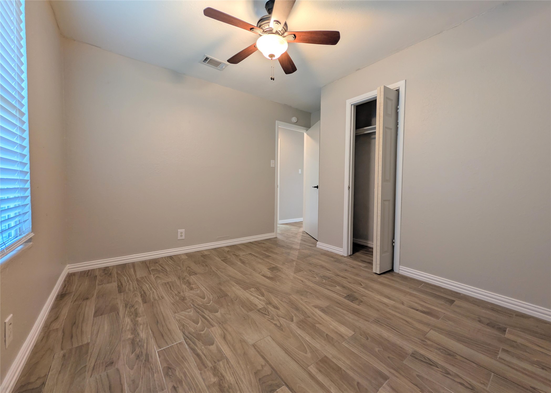12601 Turtle Rock Road, Unit B Austin, TX 78729 - Photo 11 of 20 Bedroom 2 is on the left of the hallway