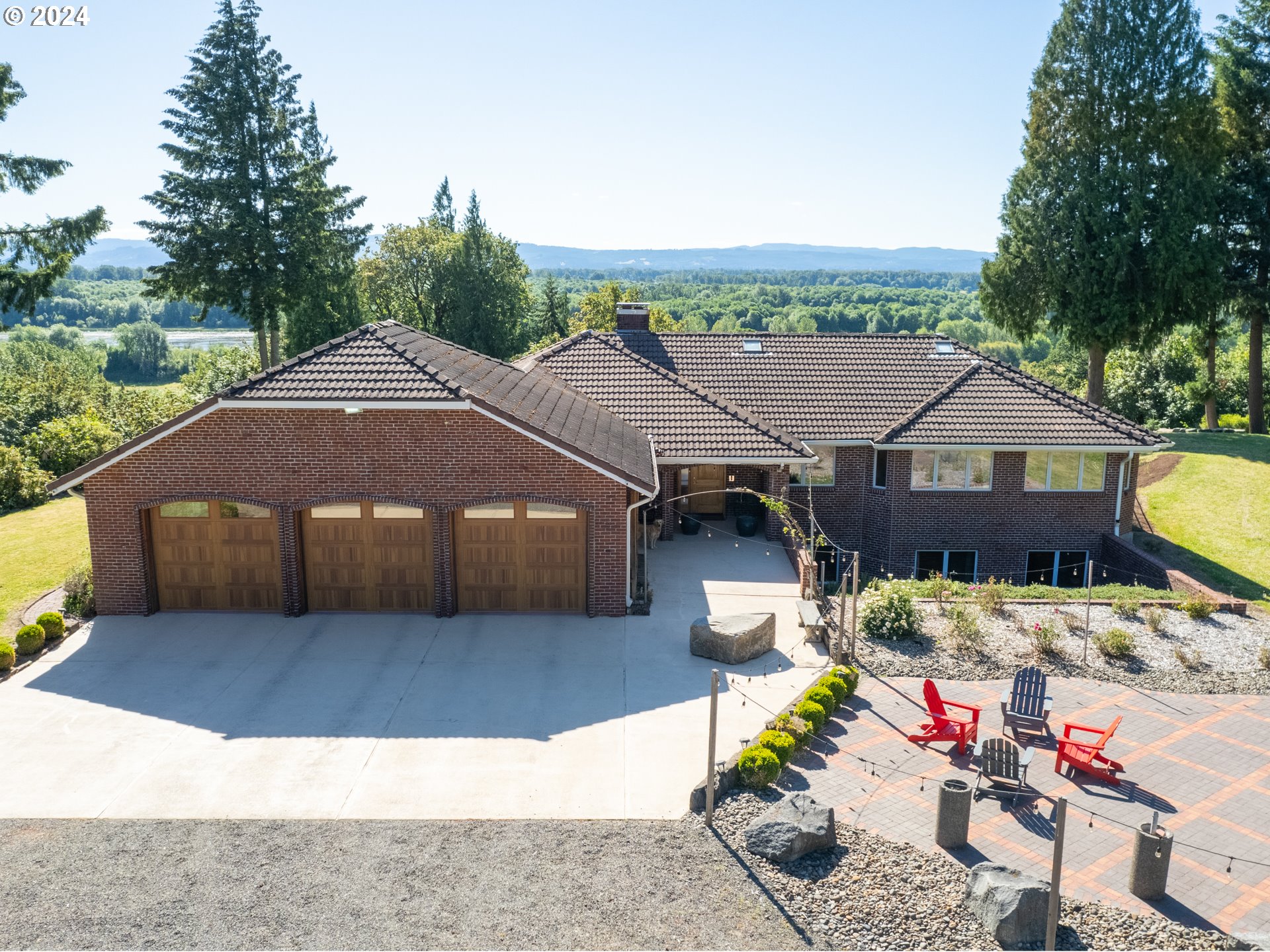 21920 Northwest 67th Avenue Ridgefield, WA 98642 - Photo 13 of 48 a view of a house with a yard and sitting area
