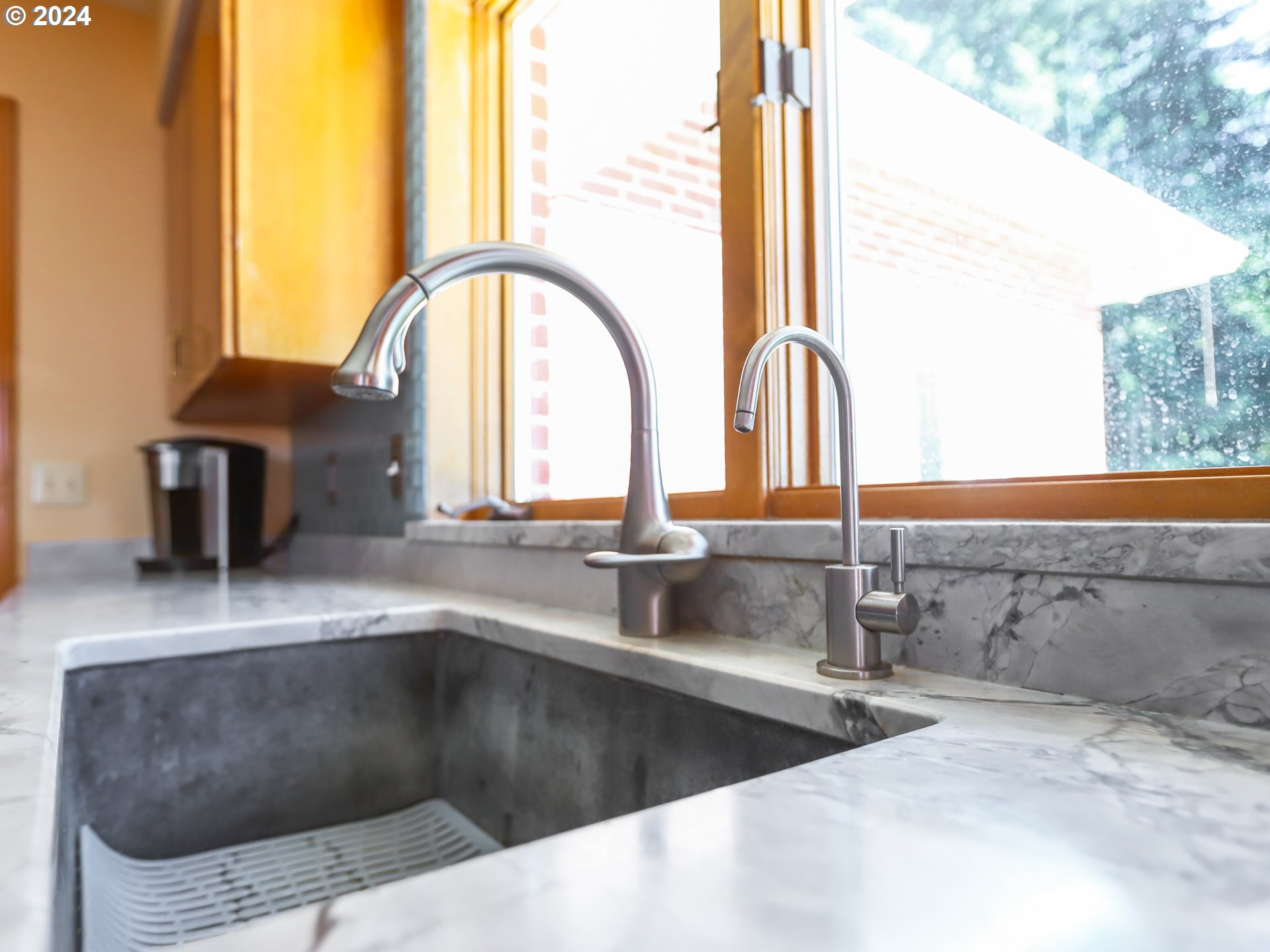 21920 Northwest 67th Avenue Ridgefield, WA 98642 - Photo 15 of 48 a kitchen with a sink and a large window
