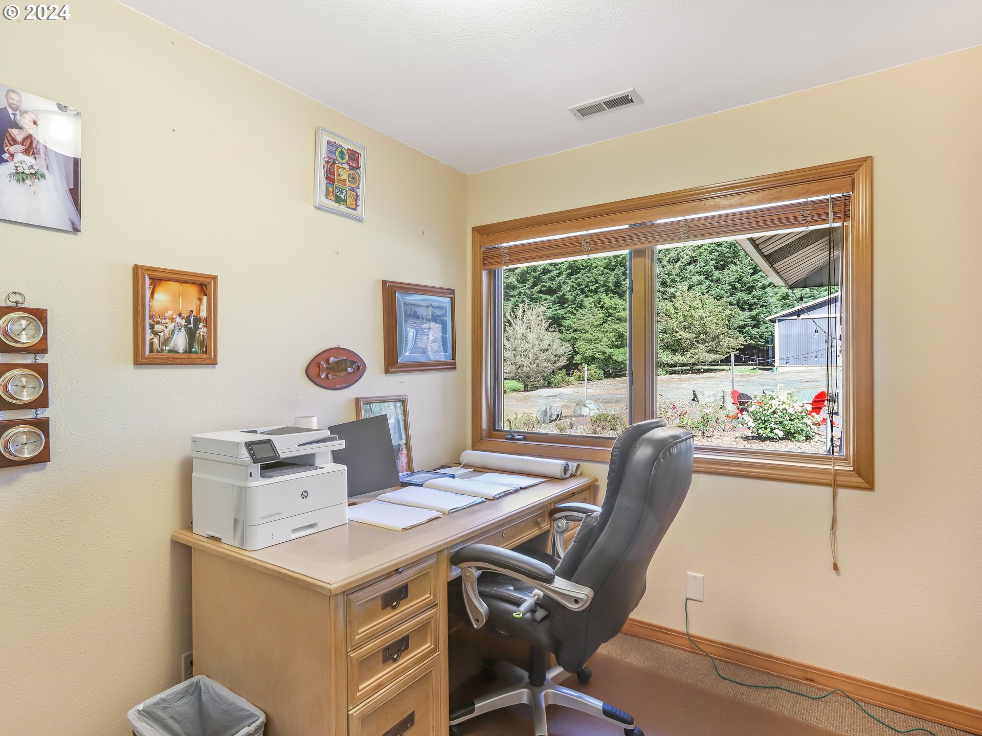 21920 Northwest 67th Avenue Ridgefield, WA 98642 - Photo 26 of 48 a view of a workspace with furniture and a window