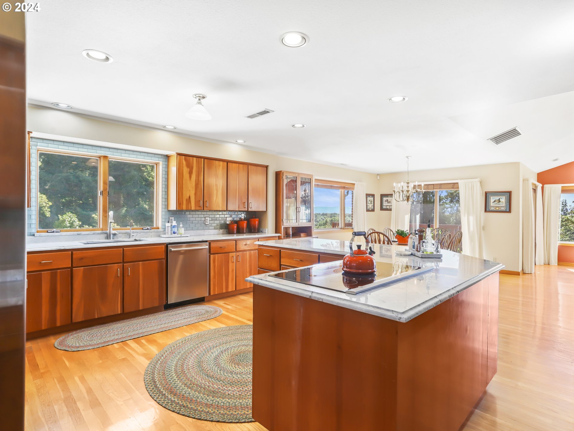 21920 Northwest 67th Avenue Ridgefield, WA 98642 - Photo 29 of 48 a dining hall with stainless steel appliances granite countertop a stove and a sink
