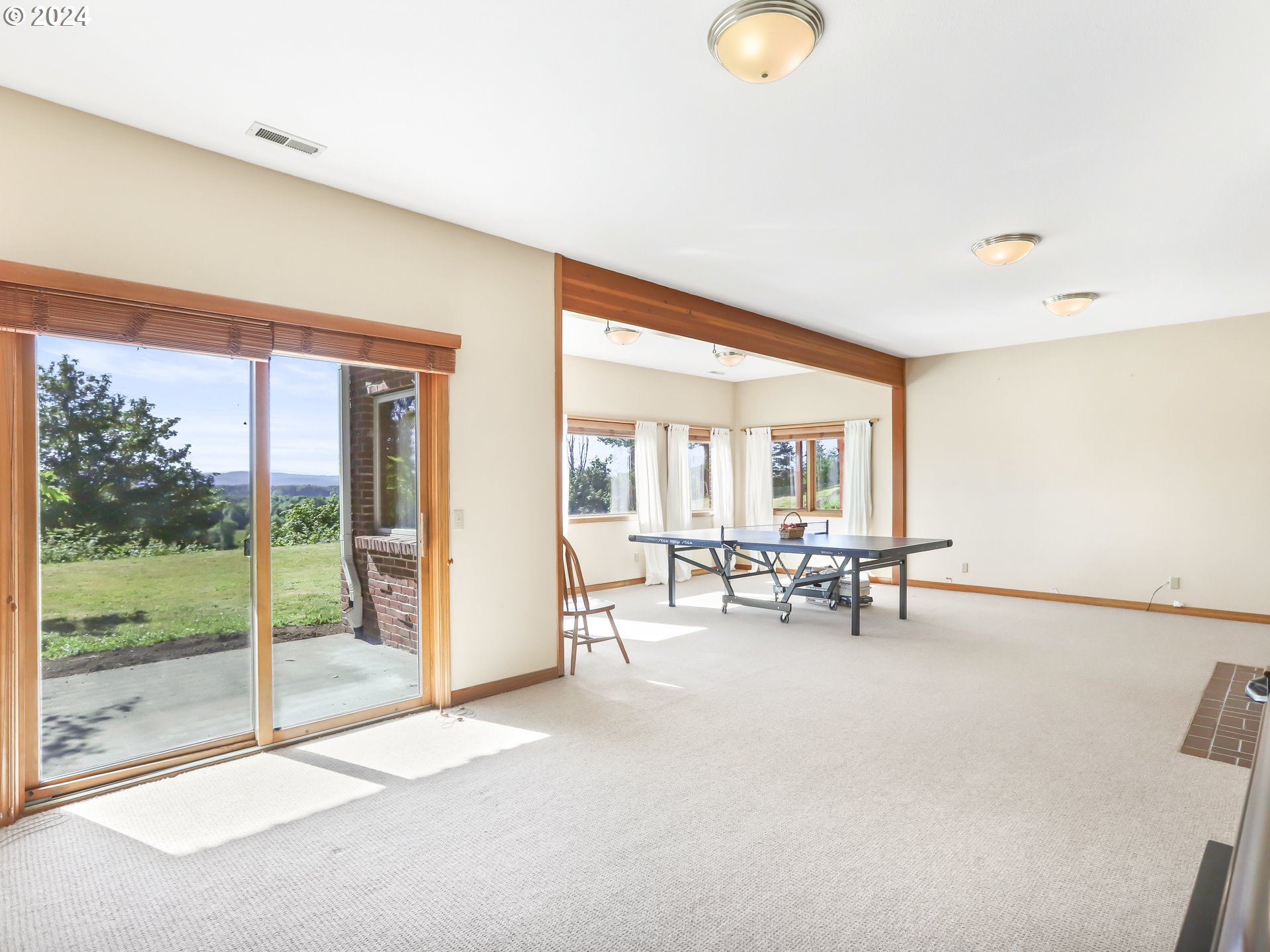 21920 Northwest 67th Avenue Ridgefield, WA 98642 - Photo 31 of 48 a view of living room with furniture and floor to ceiling window
