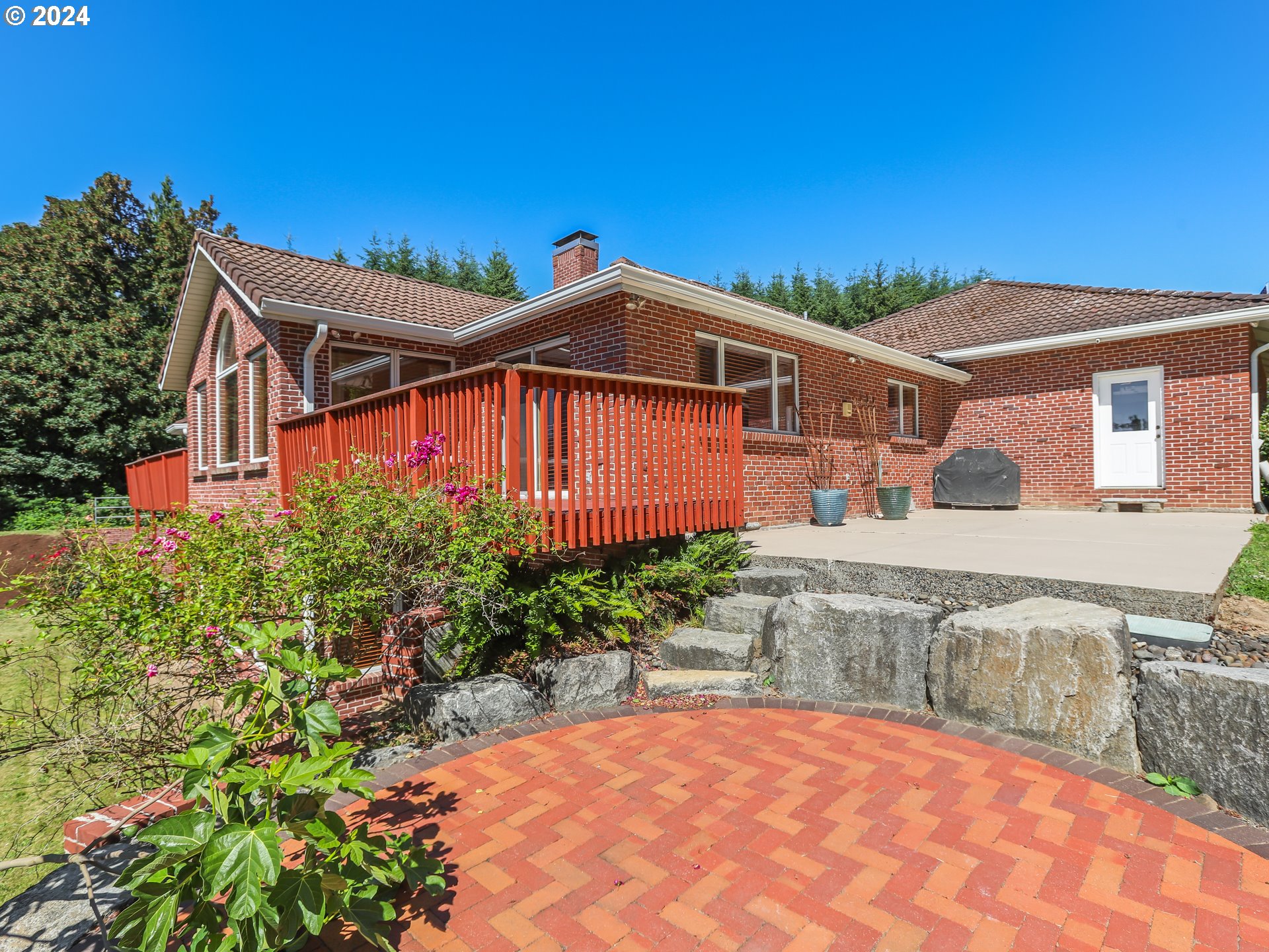 21920 Northwest 67th Avenue Ridgefield, WA 98642 - Photo 46 of 48 a front view of a house with a yard