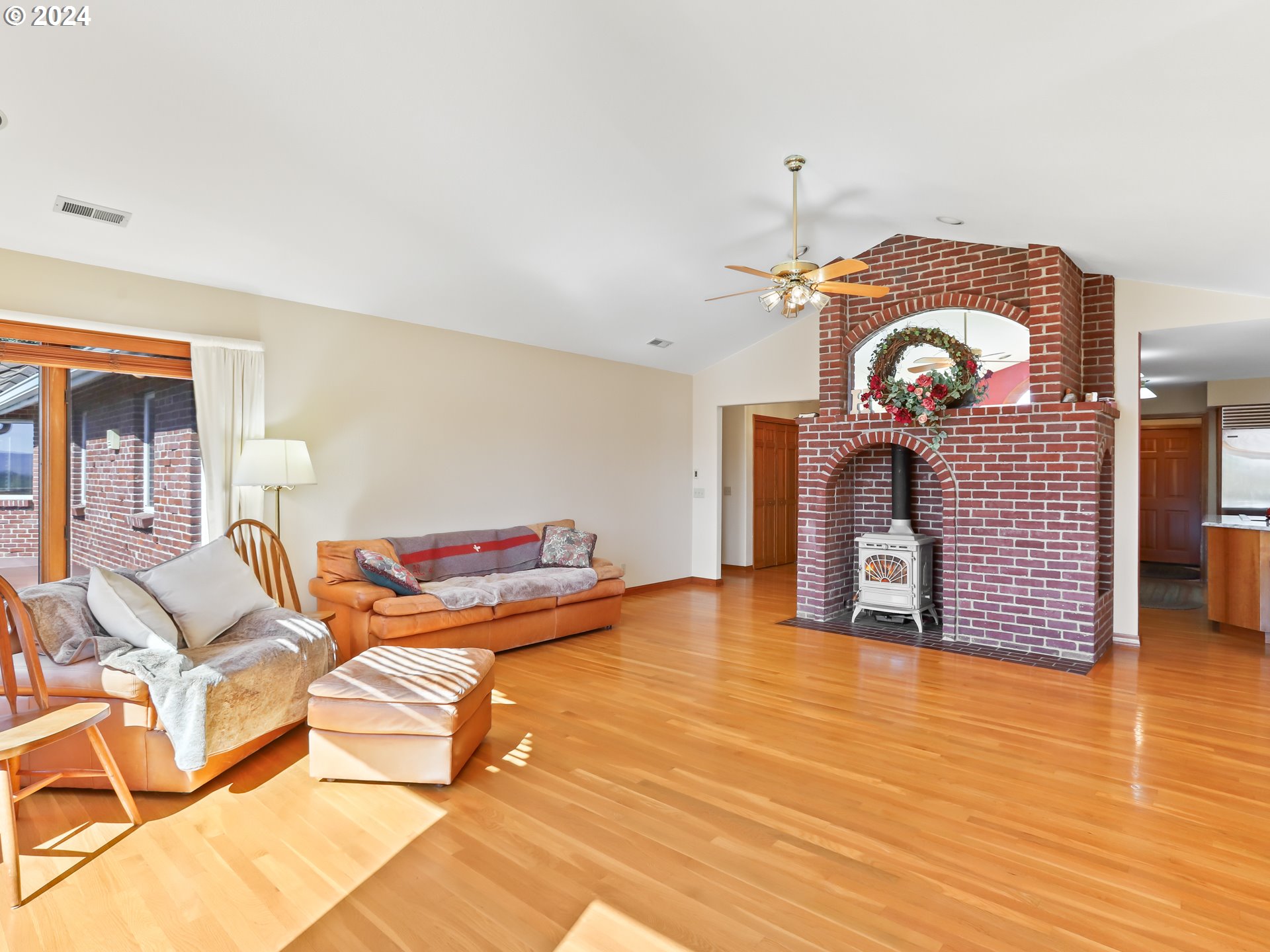 21920 Northwest 67th Avenue Ridgefield, WA 98642 - Photo 8 of 48 a living room with fireplace furniture and a wooden floor