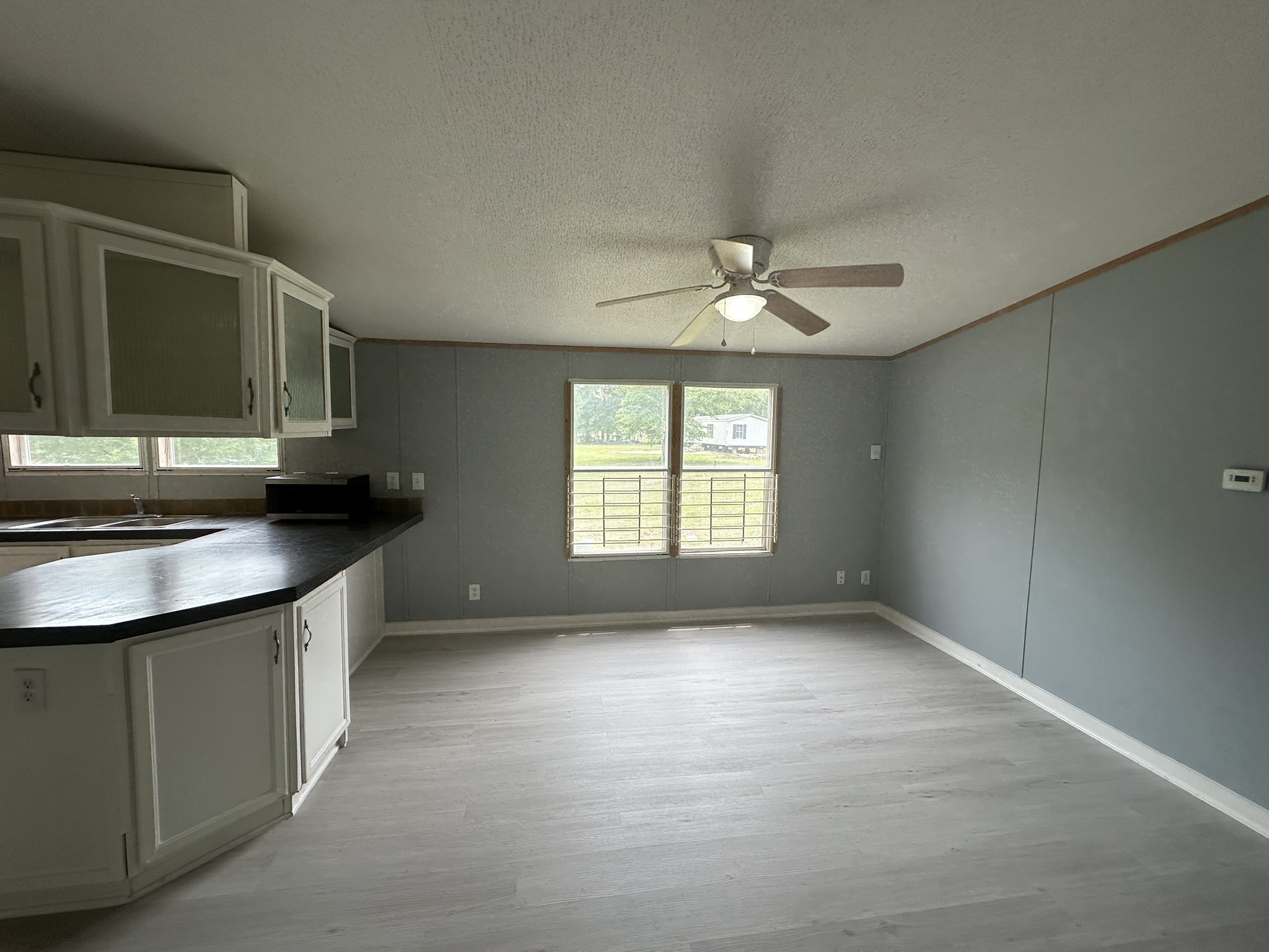2229 Meekins Road Cleveland, TX 77328 - Photo 11 of 48 a view of a kitchen with a sink and a dishwasher