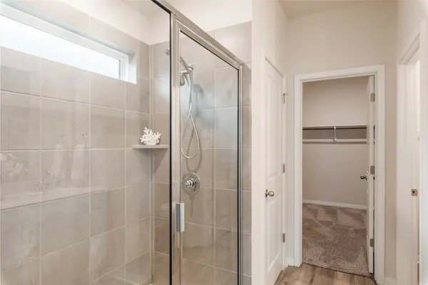 a bathroom with a double vanity sink and mirror