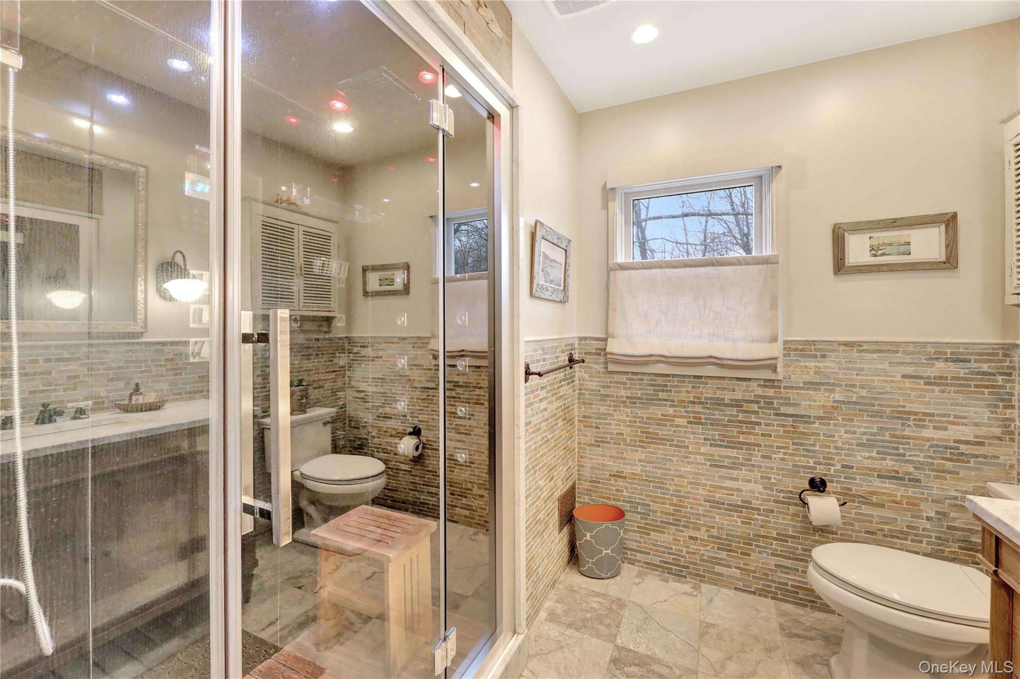 198 South Country Road Remsenburg, NY 11960 - Photo 35 of 49 a bathroom with a toilet sink and shower