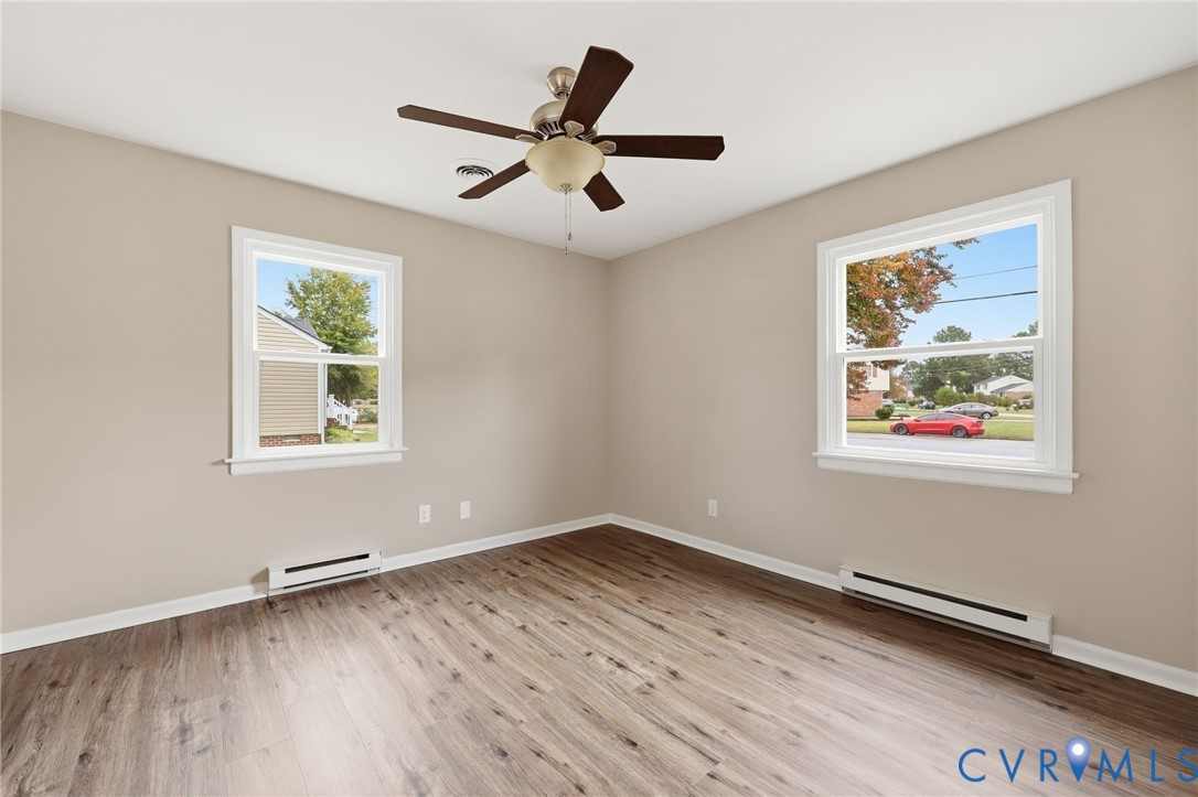 5106 Conduit Road Colonial Heights, VA 23834 - Photo 14 of 26 Empty room with a baseboard heating unit, plenty o