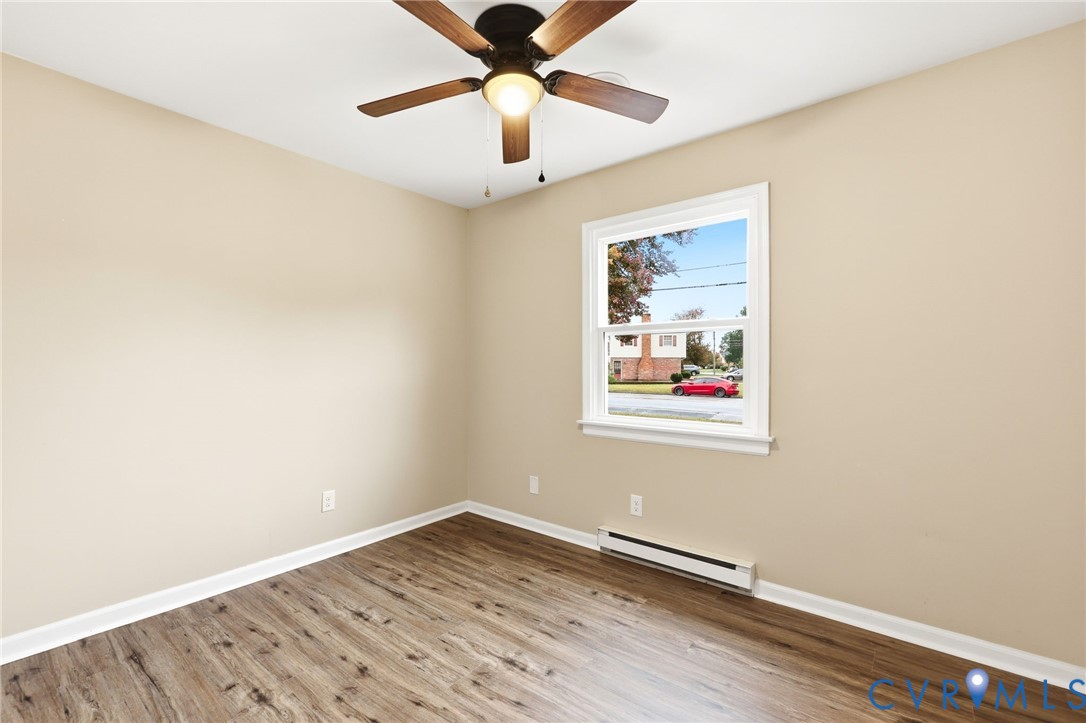 5106 Conduit Road Colonial Heights, VA 23834 - Photo 15 of 26 Spare room featuring a baseboard radiator, light w