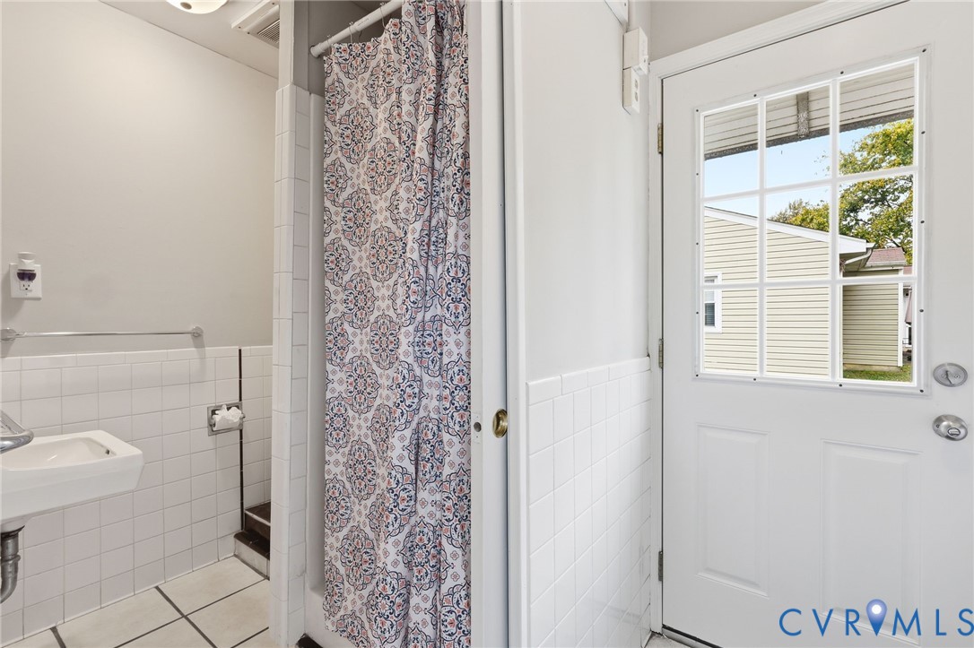 5106 Conduit Road Colonial Heights, VA 23834 - Photo 21 of 26 Bathroom featuring tile patterned floors, a shower