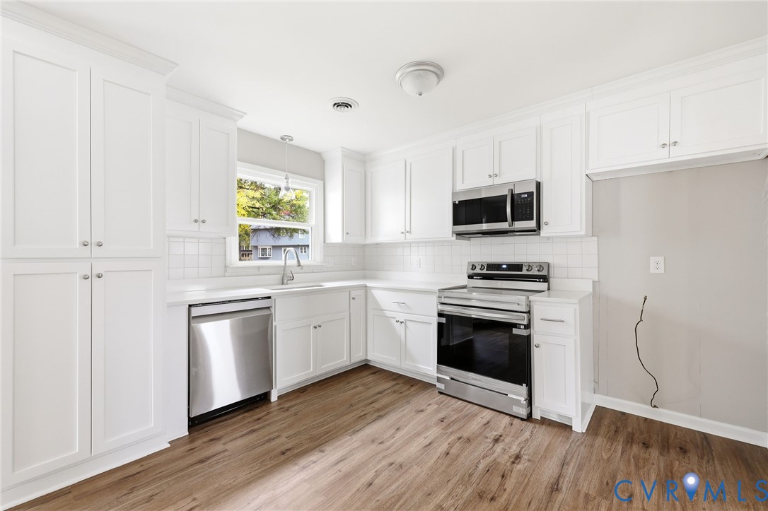 5106 Conduit Road Colonial Heights, VA 23834 - Photo 9 of 26 Kitchen featuring backsplash, appliances with stai