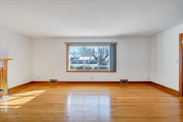 a large kitchen with stainless steel appliances granite countertop a stove a sink and a refrigerator