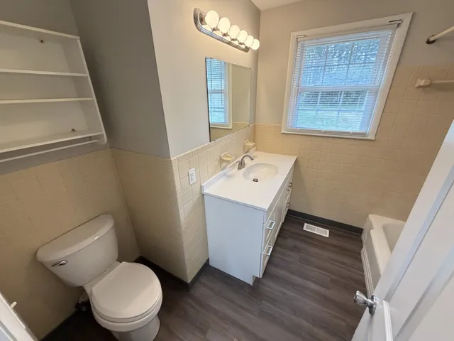 a bathroom with a bathtub and shower