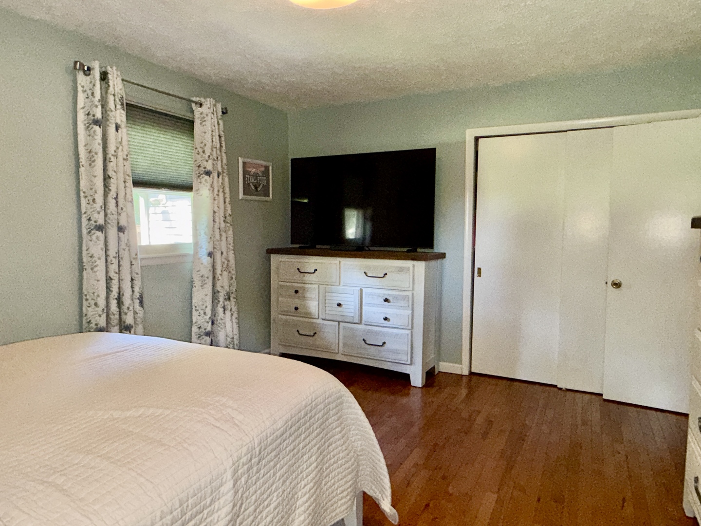 956 Country Club Road Metropolis, IL 62960 - Photo 15 of 48 a bedroom with a bed and a flat screen tv