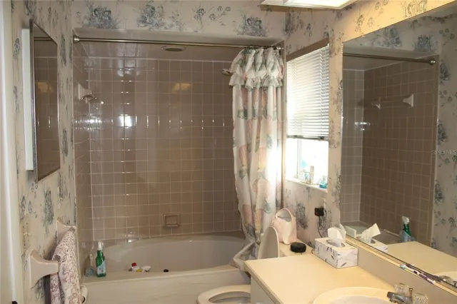 a bathroom with a bathtub and a sink