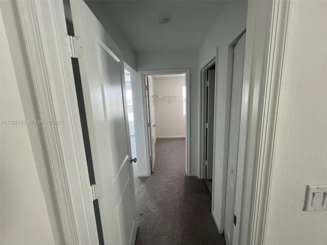 a white bath tub sitting next to a white toilet