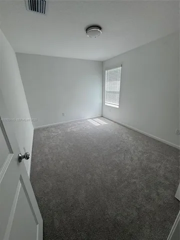 an aerial view of house with yard and garage