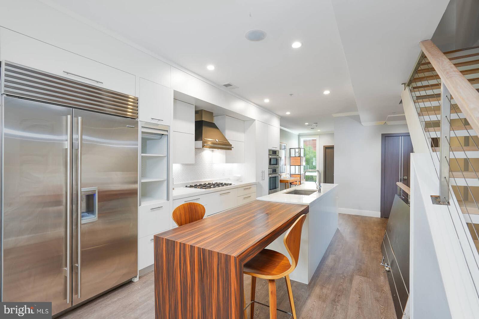 1461 Chapin Street Northwest Washington, DC 20009 - Photo 11 of 67 a kitchen with refrigerator and window