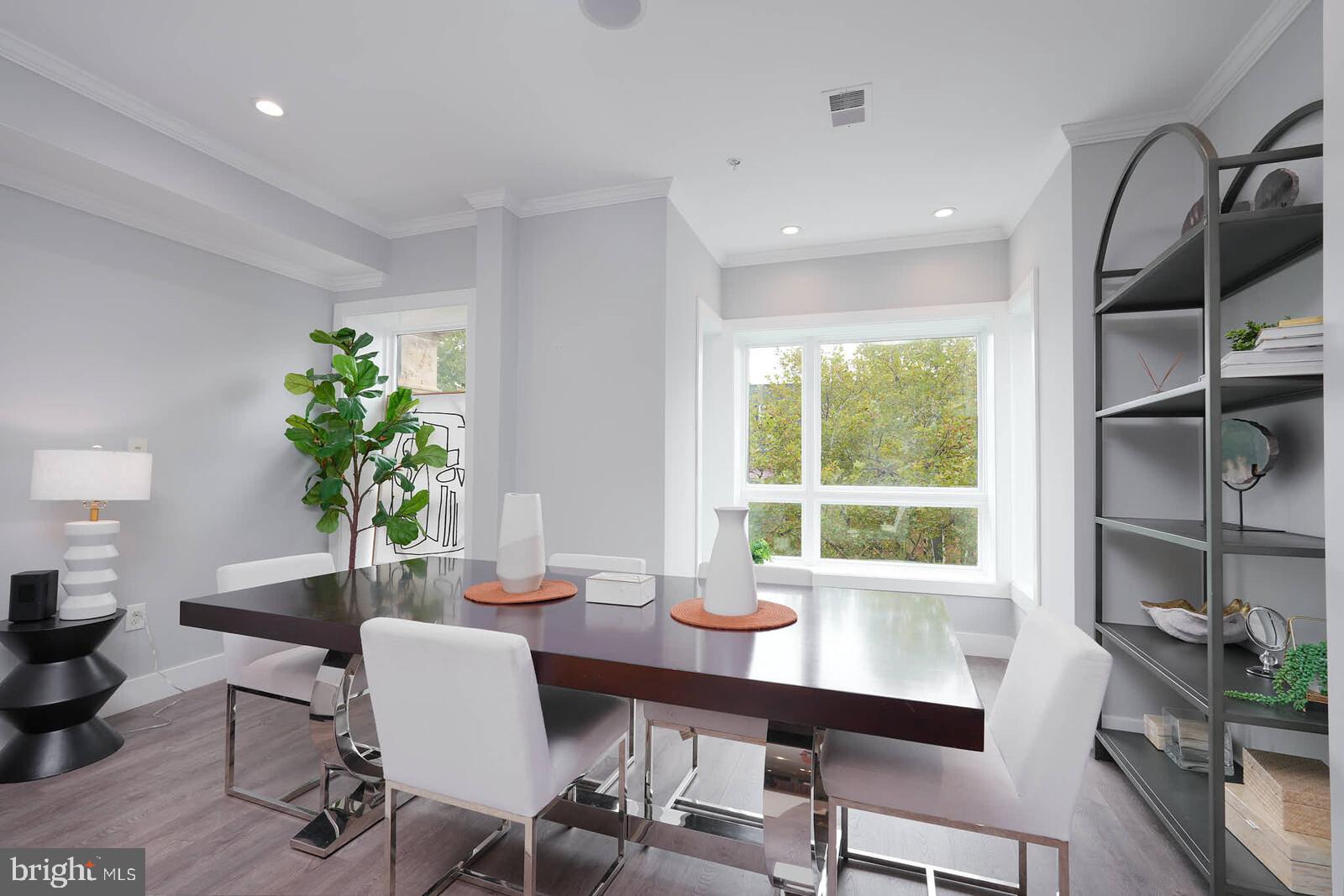 1461 Chapin Street Northwest Washington, DC 20009 - Photo 14 of 67 a view of a dining room with furniture window and wooden floor