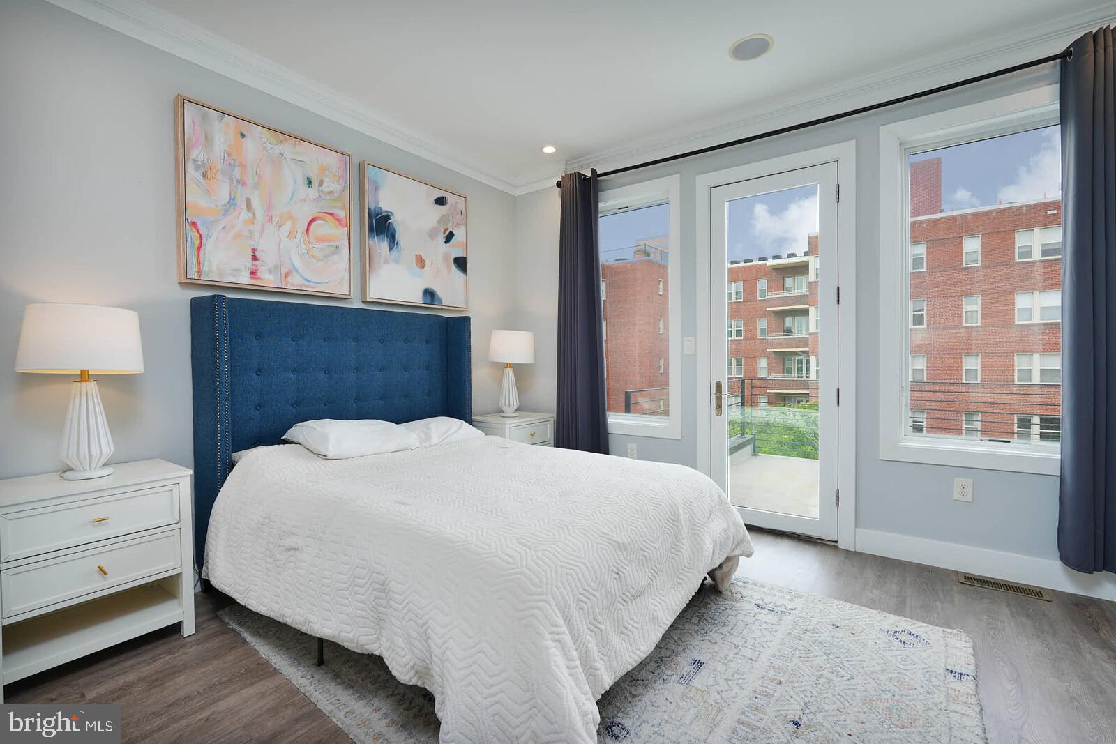 1461 Chapin Street Northwest Washington, DC 20009 - Photo 19 of 67 a bedroom with a large bed and a window