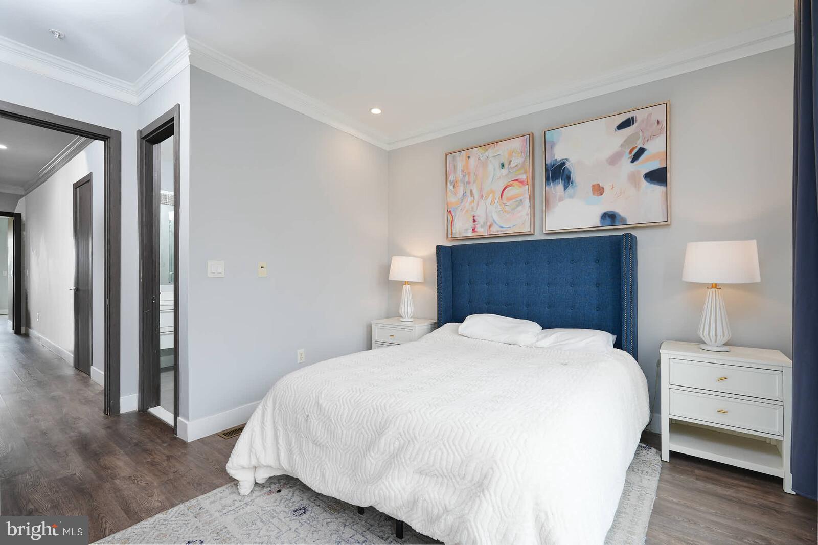 1461 Chapin Street Northwest Washington, DC 20009 - Photo 20 of 67 a bedroom with a bed and a painting on the wall