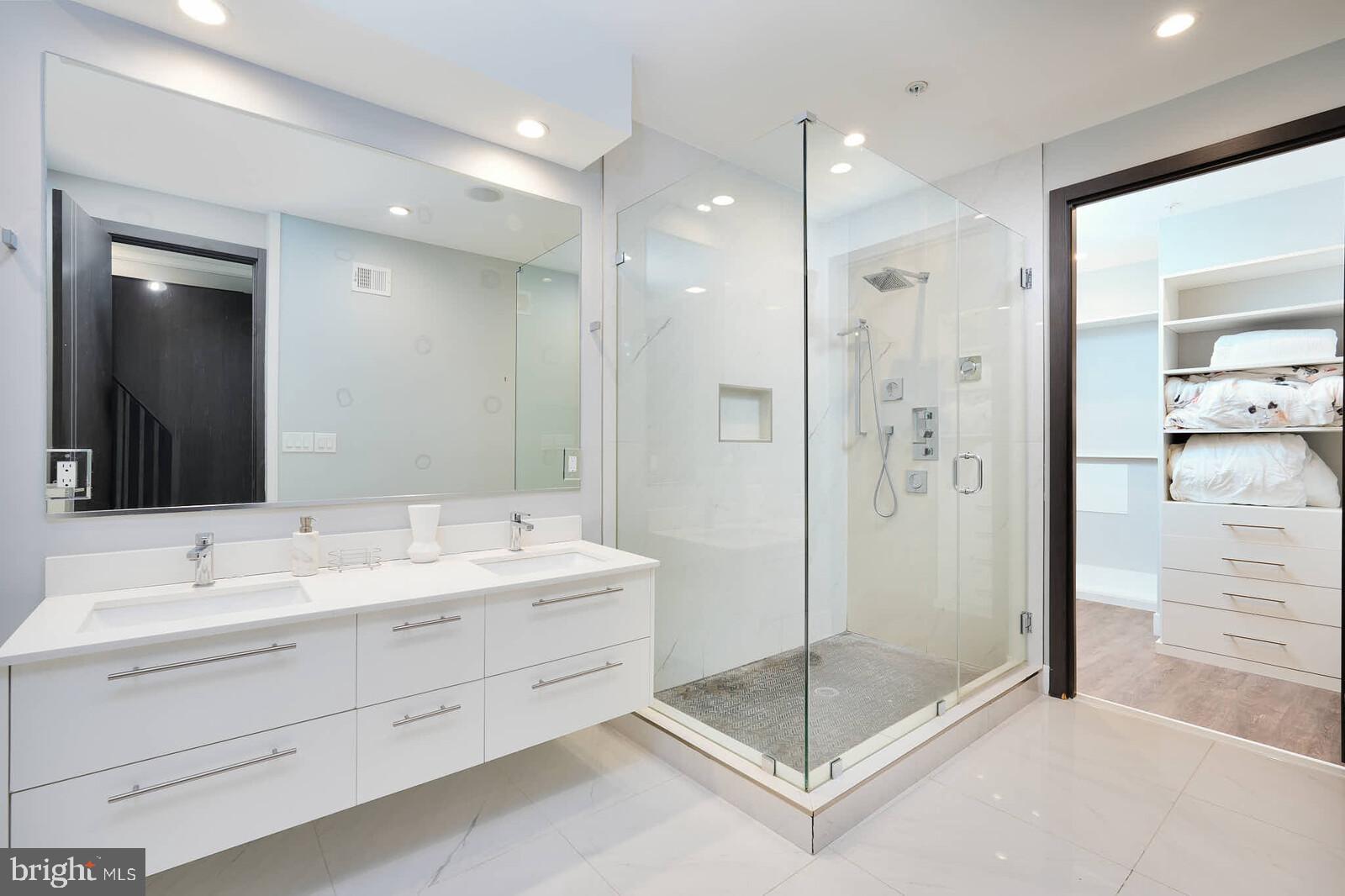 1461 Chapin Street Northwest Washington, DC 20009 - Photo 24 of 67 a bathroom with a shower sink and mirror