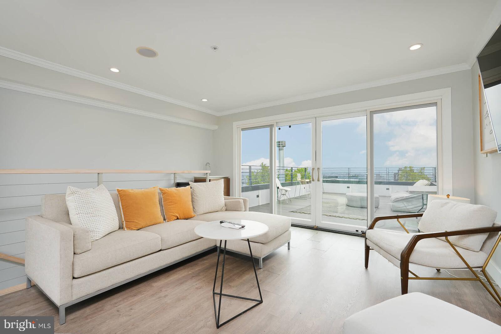 1461 Chapin Street Northwest Washington, DC 20009 - Photo 30 of 67 a living room with furniture and a large window