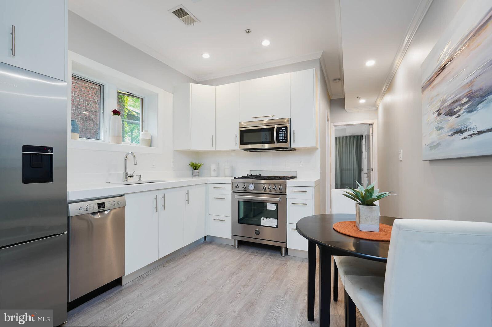 1461 Chapin Street Northwest Washington, DC 20009 - Photo 33 of 67 Modern kitchen with sleek finishes.