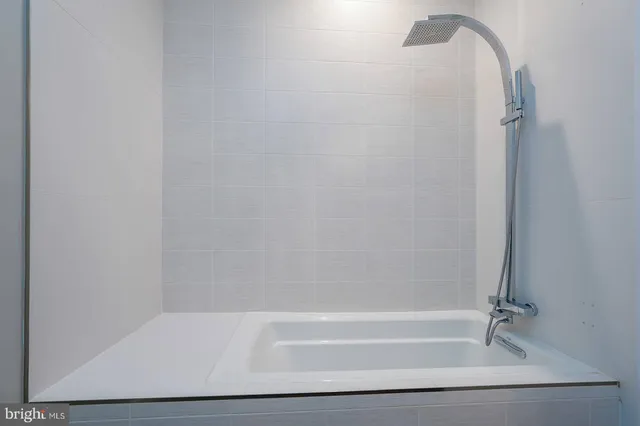 a bathroom with a double vanity sink and mirror
