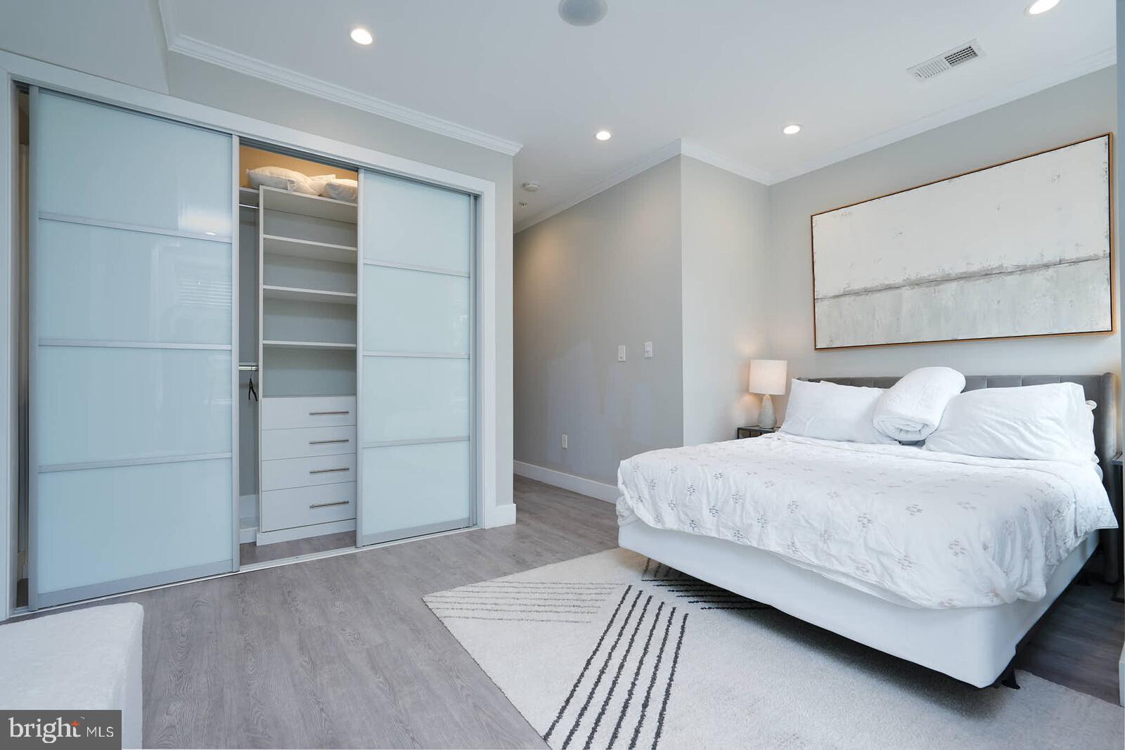 1461 Chapin Street Northwest Washington, DC 20009 - Photo 41 of 67 a bedroom with a bed and a walk in closet